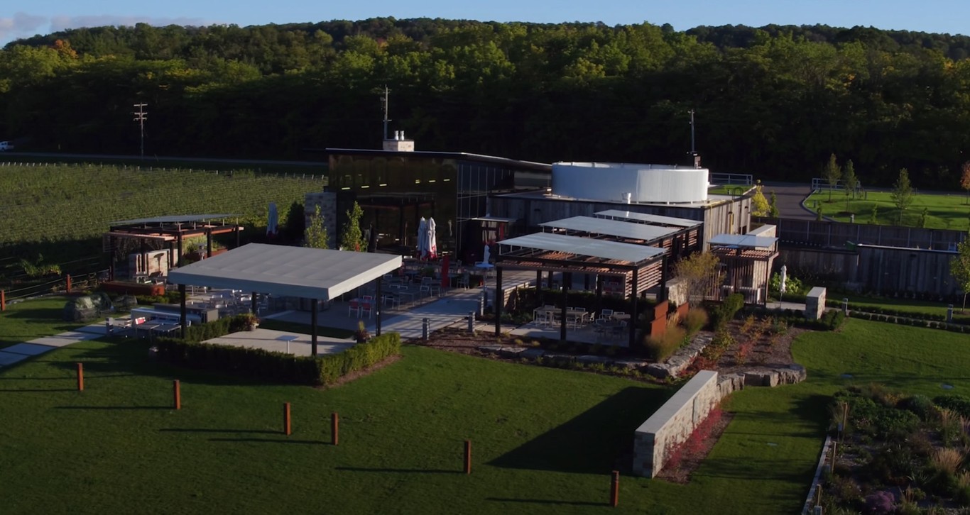 Commercial landscaping with extensive lawn areas and retaining walls